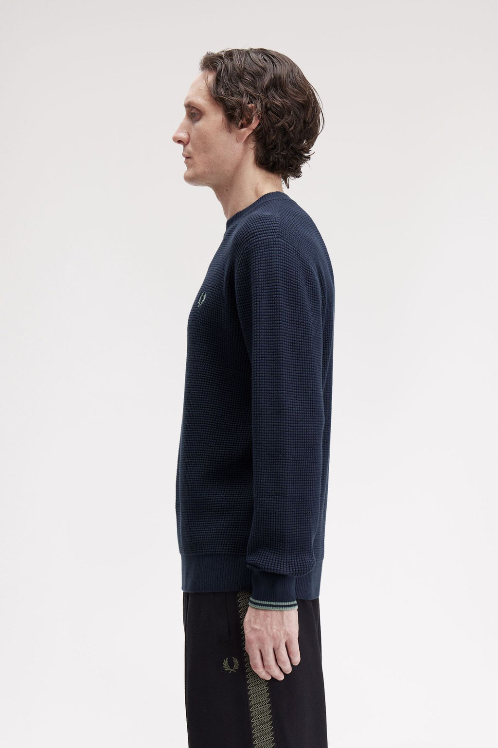 Pulls navy Fred Perry