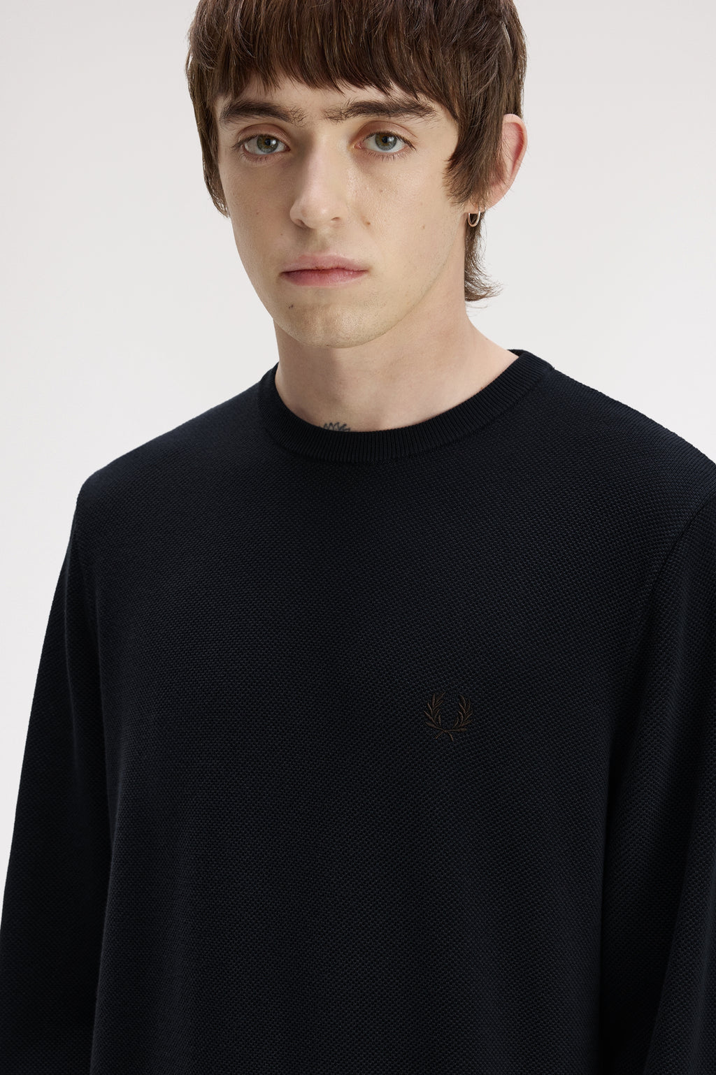 Pulls navy Fred Perry