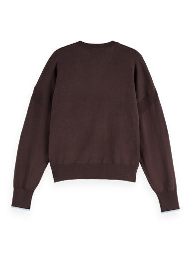 Pulls bruin Scotch & Soda